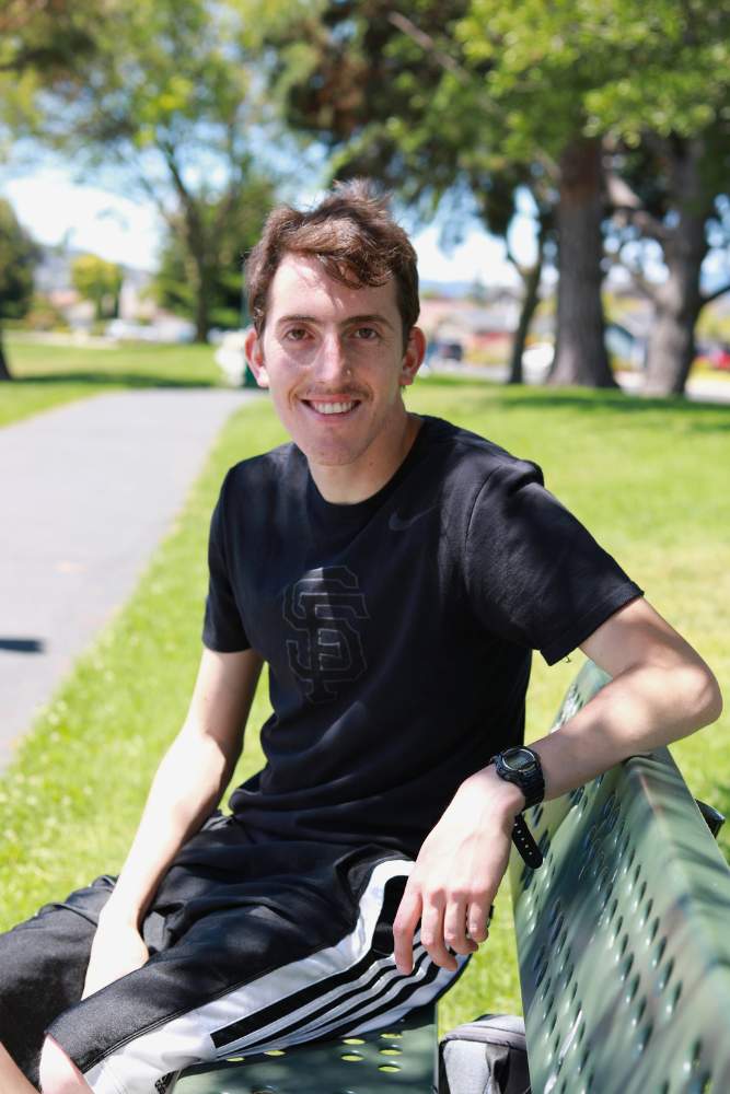 Larry sitting in a park