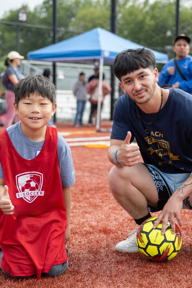 E-Life coach with a young athlete on the field